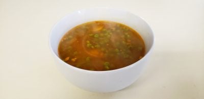 Spicy savory vegan Indian soup with peas and potatoes