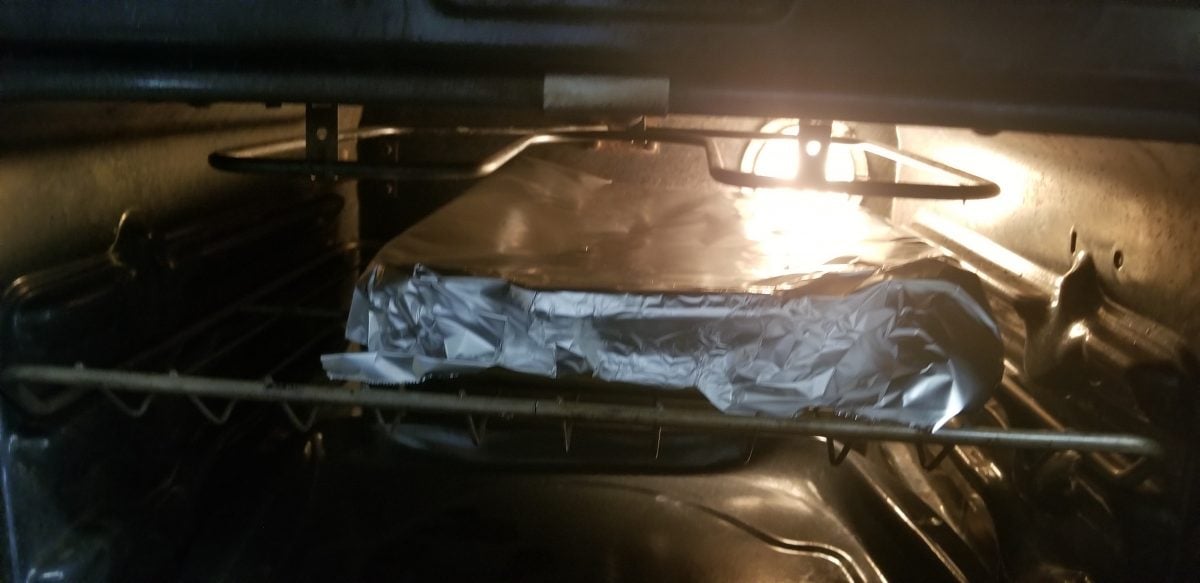 covered casserole in tinfoil cooking